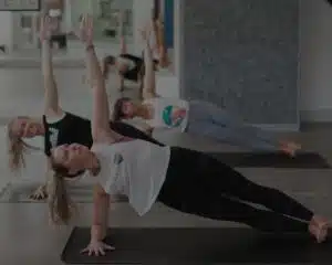 People doing yoga in a yoga studio